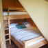 Slaapkamer met 2 persoonsbed en hoogslaper